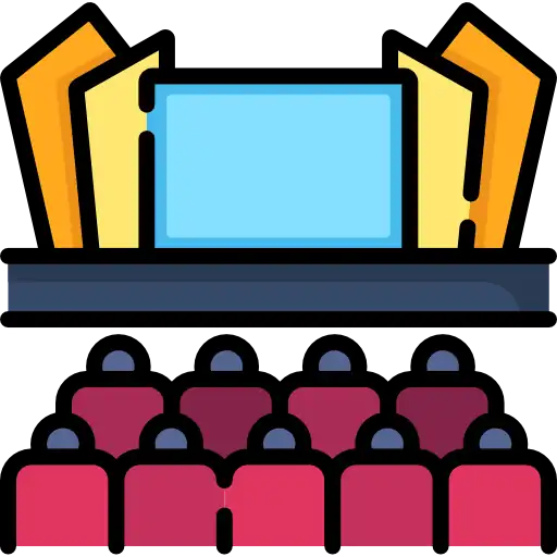 Conference stage with podium and microphone set up for speakers in a bright, professional event hall. The atmosphere is energetic and welcoming, suggesting an environment for learning and networking. No visible text in the image.